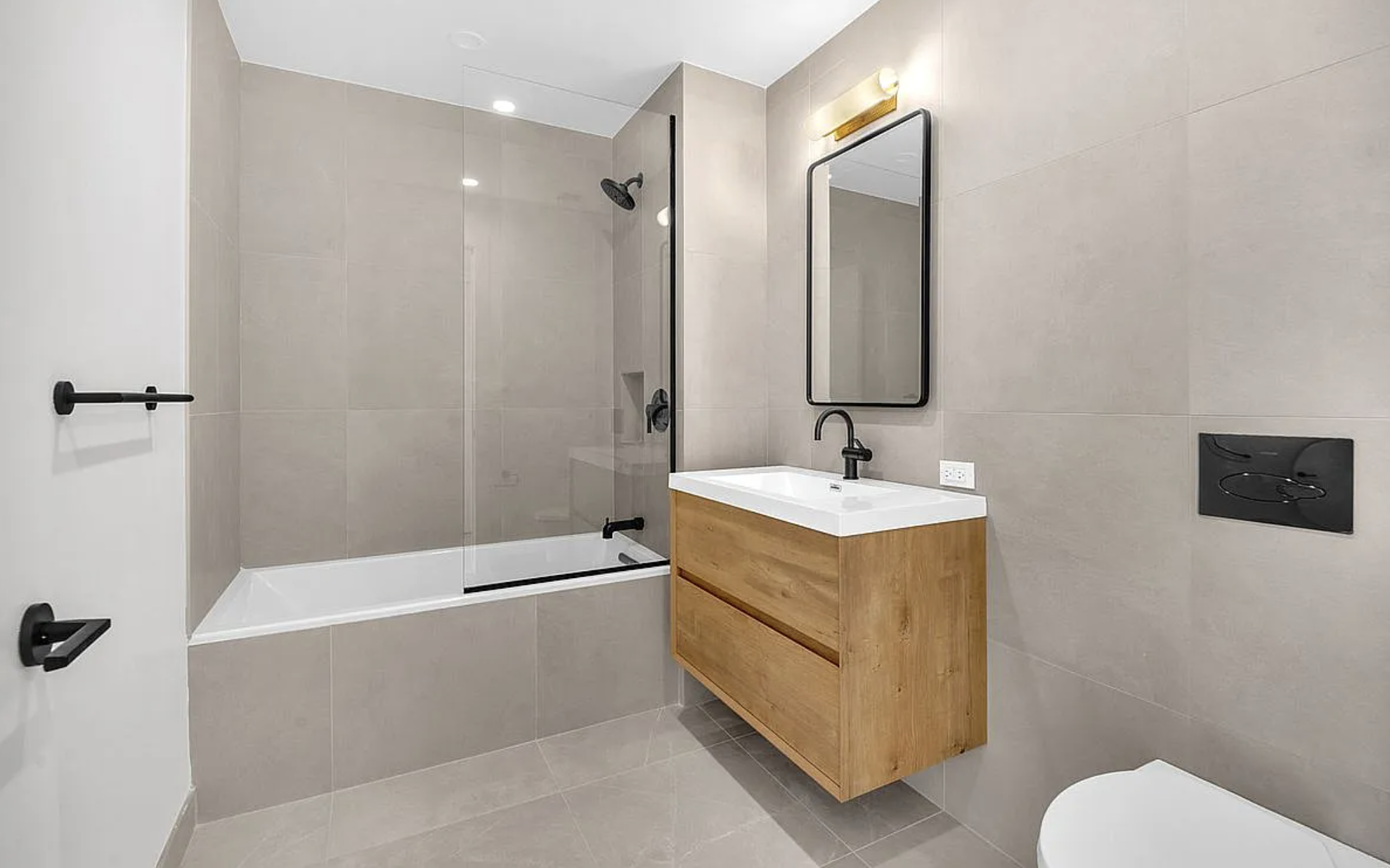 Long Island City modern stone bathroom renovation in Queens NYC